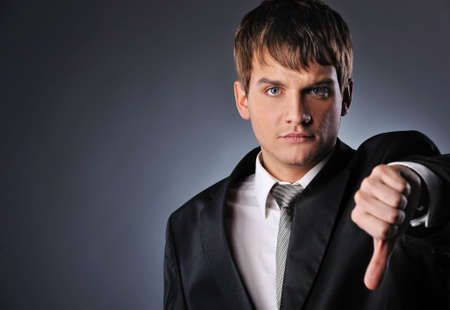 Businessman showing his thumb downの写真素材