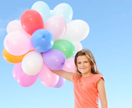 Happy girl with balloons の写真素材