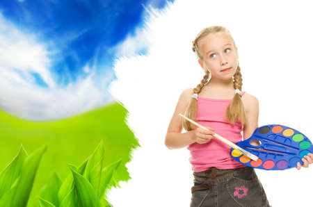 Beautiful little girl painting nature lanscapeの写真素材