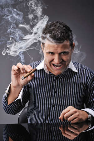 Portrait of a man smoking cigarの写真素材