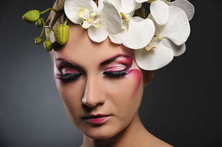 Beautiful woman with creative make-upの写真素材