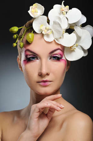 Beautiful woman with creative make-upの写真素材