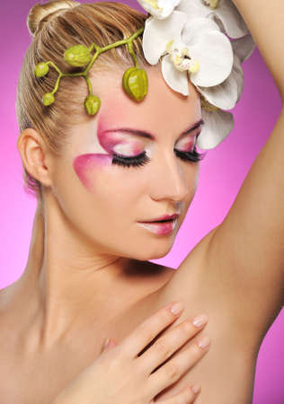 Beautiful woman with creative make-upの写真素材