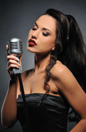 Beautiful brunette woman singing 
の写真素材