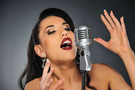  Beautiful brunette woman singing 
の写真素材