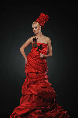 Beautiful lady with a red rose
の写真素材