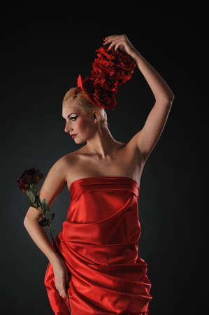 Beautiful lady with a red rose
の写真素材