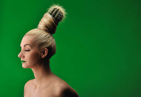 Woman with cactus in her hairの写真素材