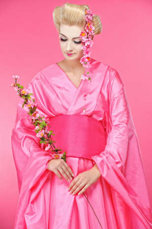 Beautiful geisha with a sacura の写真素材