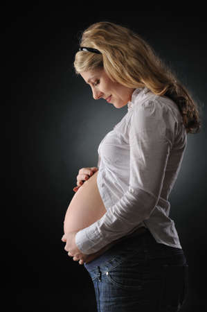 Beautiful pregnant woman expecting a babyの写真素材