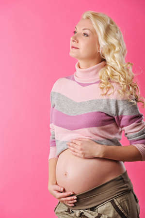 Beautiful pregnant woman expecting a babyの写真素材