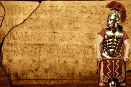 Roman legionary soldier in front of abstract wallの写真素材