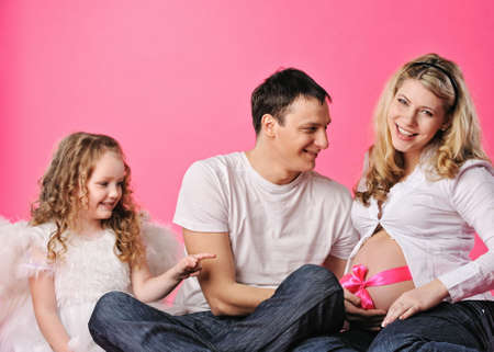 Portrait of a happy young family expecting a babyの写真素材
