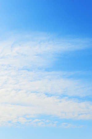 Blue sky with fluffy cloudsの写真素材