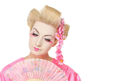 Beautiful geisha with a fanの写真素材