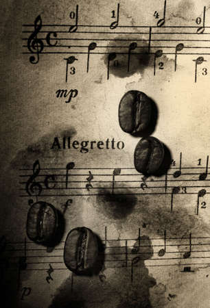 Coffee beans on a grungy musical backgroundの写真素材