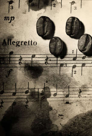 Coffee beans on a grungy musical backgroundの写真素材