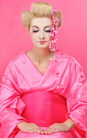 Portrait of a praying geishaの写真素材