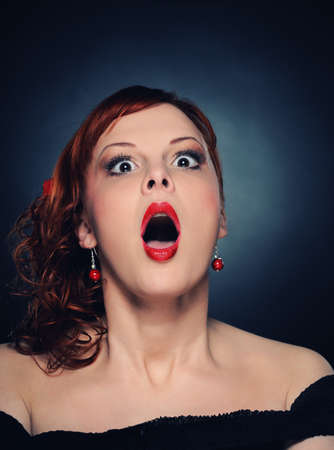 Screaming attractive redhead womanの写真素材