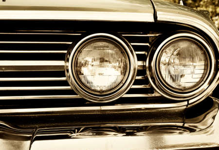 Close-up photo of retro car headlightsの写真素材