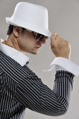 Handsome man in white hatの写真素材
