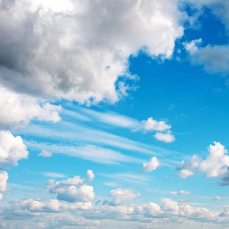 Blue sky with fluffy cloudsの写真素材