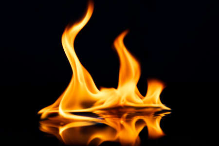Beautiful stylish fire flames reflected in waterの写真素材
