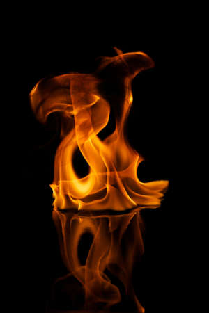 Beautiful stylish fire flames reflected in water