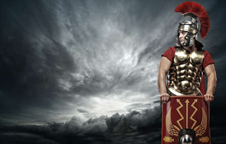 Legionary soldier over stormy skyの写真素材