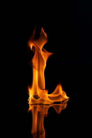 Fire flames reflected in waterの写真素材