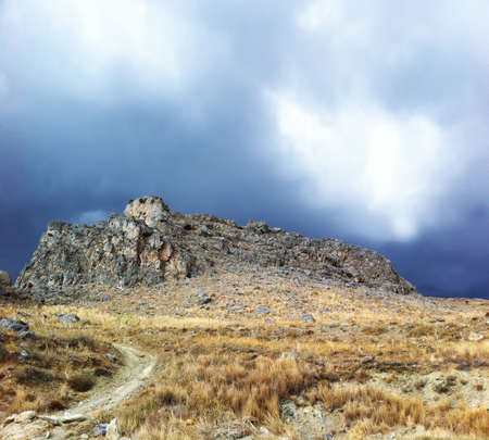 Rock over stormy skyの写真素材