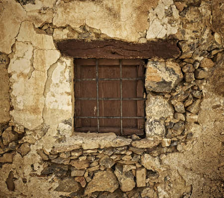 Window in the stone wallの写真素材