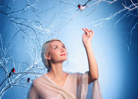 Attractive woman in winter forestの写真素材