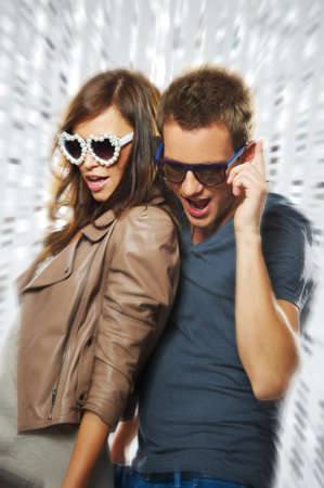 Stylish couple dancing in the nightclubの写真素材