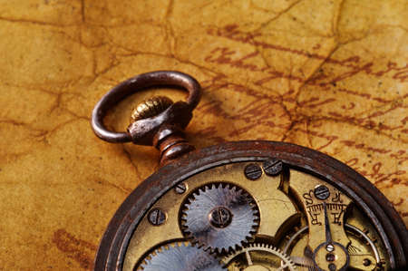 Ancient gears on the old textured paperの写真素材