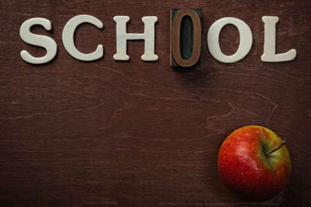 The word school written on wooden backgroundの写真素材