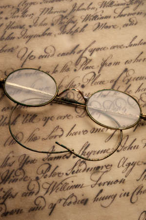 Old glasses on the vintage document