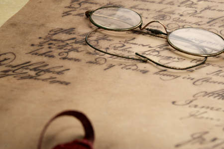 Old glasses on the vintage document