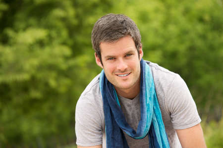 Smiling handsome man outdoors の写真素材