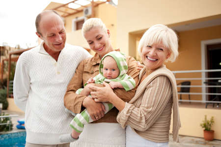 Happy family outdoors.の写真素材