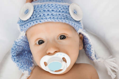 Cute baby with a pacifier.の写真素材