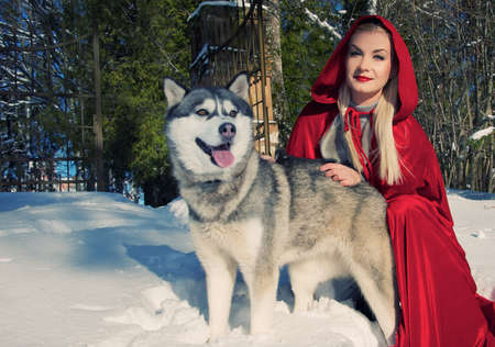 Smiling Red Hood with a wolf