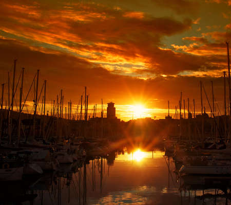 Yachts & boats in a harbour on dusk.の写真素材