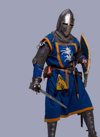Medieval knight on grey background.