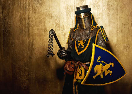 Medieval knight on golden background.の写真素材