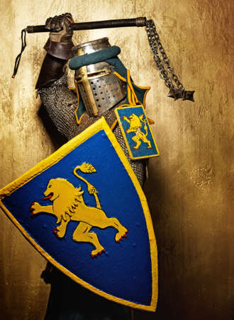 Medieval knight on golden background.の写真素材