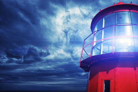 Lighthouse against  stormy sky.の写真素材
