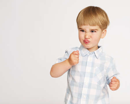 Funny baby boy in chekered shirtの写真素材