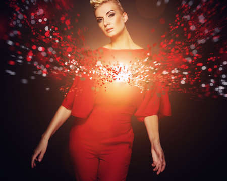 Conceptual picture of a fashionable woman in red 