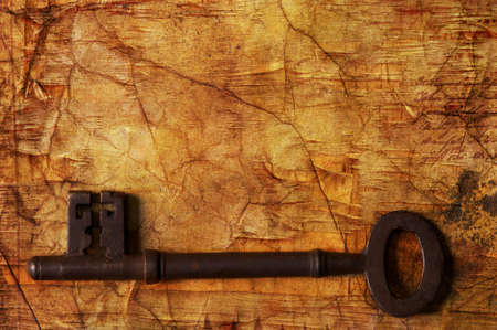 Old key on wooden backgroundの写真素材